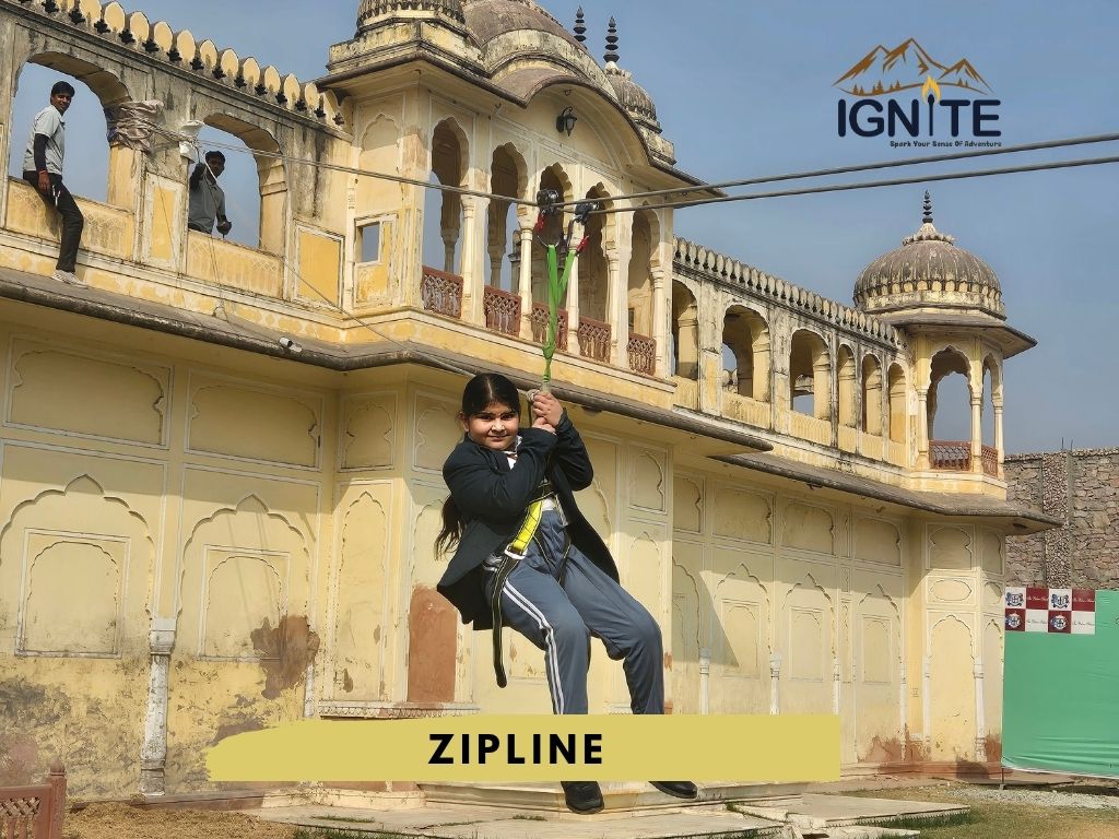 A girl on a zipline in front of a historic building